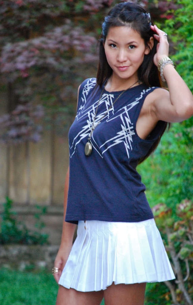 Geometric Tee and White Pleated Mini Skirt