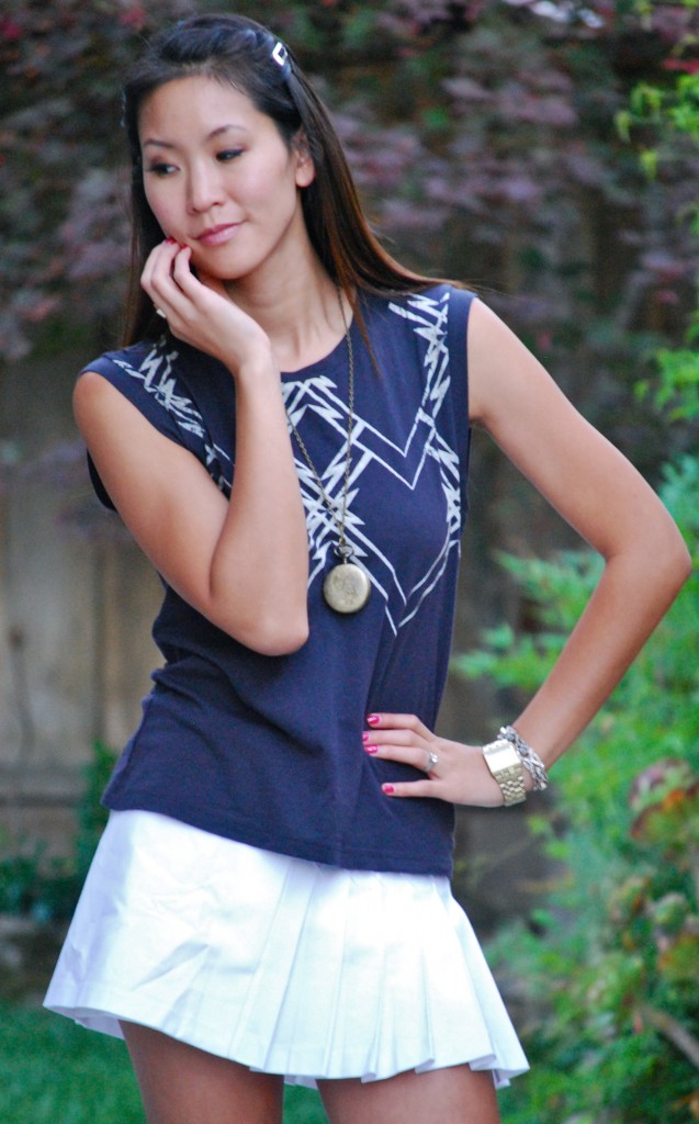 Geometric Tee and White Pleated Mini Skirt